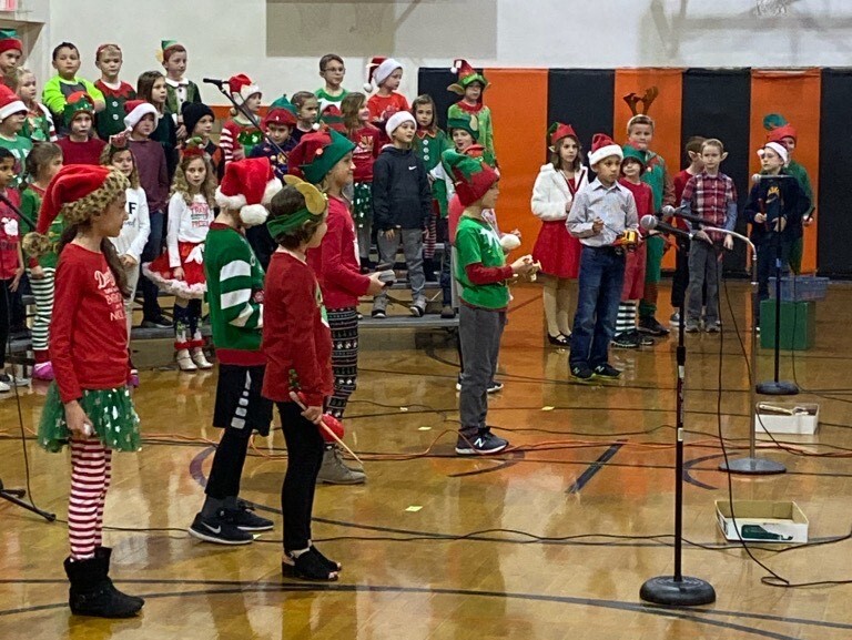 group of young people in red and green